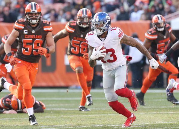 Odell Beckham Jr. evades tacklers during a game against the Browns